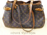 a louis vuitton handbag sitting on top of a box