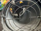 a metal fan sitting on top of a table