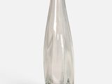 a clear glass vase that is sitting on a white surface