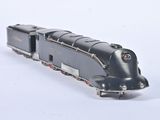 a toy train that is sitting on a white surface