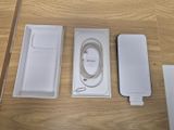 a box with a charger, a cable, and a charger attached to it