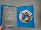 someone is holding a wii game in a blue case