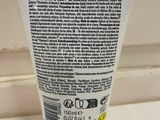 a close up of a tube of toothpaste sitting on a counter