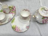 three cups and saucers sitting on a table