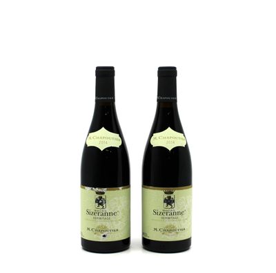 two bottles of wine sitting next to each other on a white surface
