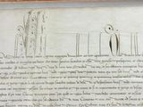 an old document with writing on it in a wooden frame