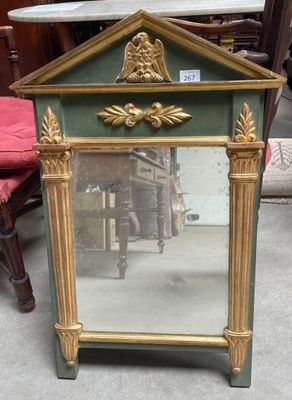 a mirror that is sitting on the floor in front of a chair