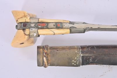 two different types of weapons displayed on a white surface