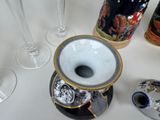 many different types of vases and glasses on the table