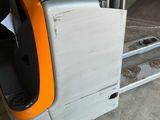 a fork lift truck with a box on the back of it