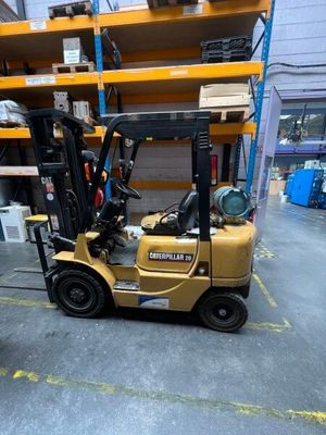 a forklift that is parked in a warehouse