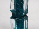 a glass vase that has a blue design on it