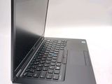 a laptop computer sitting on top of a white table