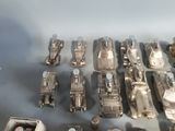 a lot of silver toy cars that are on a table