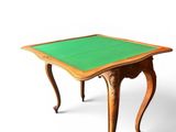 an image of a small table with a green top on a white background