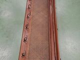 an image of a long wooden table with a cane on top of it