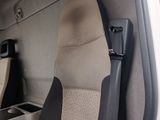 two seats in the back of a truck with a seat belt