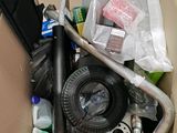 a cardboard box filled with assorted items in it