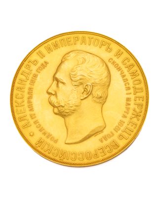 l'image d'une pièce d'or sur laquelle figure le portrait d'un homme