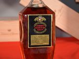 a bottle of whiskey that is sitting on a table