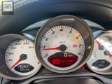 a close up of a car dashboard with various gauges