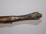 a wooden stick with a metal handle on it