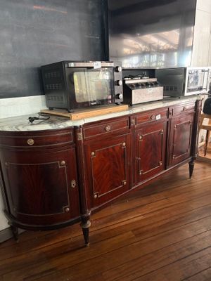 a television on a cabinet in the corner of a room
