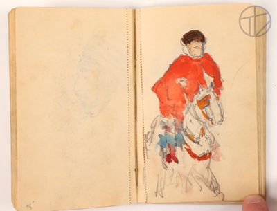 someone is holding a book with a drawing of a man on a horse