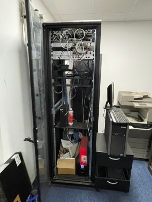 an image of a server in a room with a lot of wires