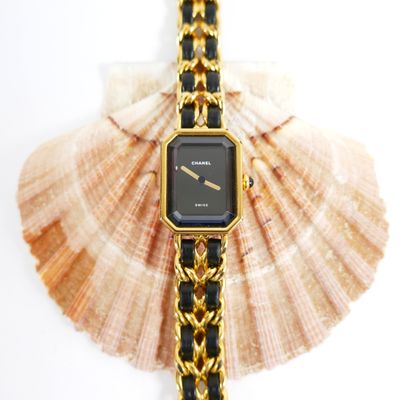 a watch that is sitting on top of a shell