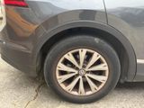 a close up of a car ' s tire on the street