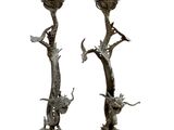 pair of bronze candlesticks with birds and flowers on them