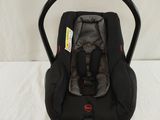 a baby car seat that is attached to the back of the car seat