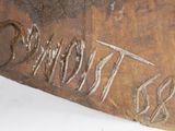 an image of a close up of a piece of wood with writing on it