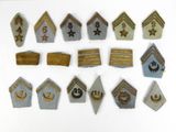 a lot of different types of badges on a white surface