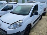 a white van parked in a lot next to other vans