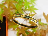 a close up of a ring on a branch of a tree