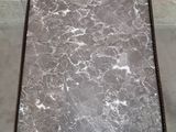 grey marble coffee table with a black metal frame