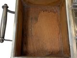 an open metal box with a handle on a white background