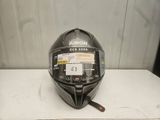 the helmet is black and has a sticker on it