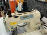 a sewing machine sitting on a table in a room