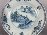 two plates with blue and white designs on them