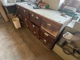 a kitchen with a lot of clutter on the counter top