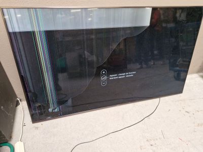 a flat screen tv sitting on the floor in the room