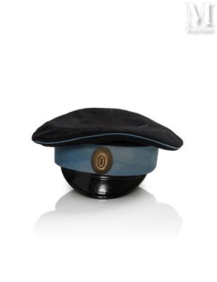 a blue hat with a gold emblem on it