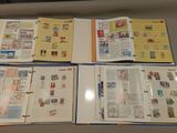 a lot of different types of stamps on a table