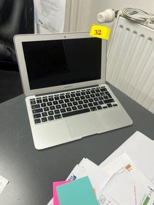 a laptop computer sitting on top of a table