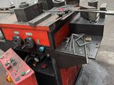a machine that is sitting on the ground in a warehouse