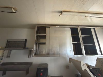 an image of a commercial kitchen with stainless steel cabinets