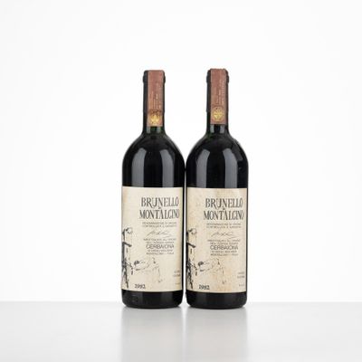 two bottles of wine sitting on top of a white table